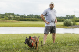 East Hartford, CT, 07/08/15; Hometown hero Bryan Colletti President & Founder of K9CS, Inc in Newington CT with dog Pretty, works with fellow K9 trainer Paul Octaviani (not pictured) at a field near the Cabela's Retail Store Wednesday evening. Collettei trains dogs, usually Belgian Malinois and German Shepherds, to be a working police K-9. photo by David Butler II